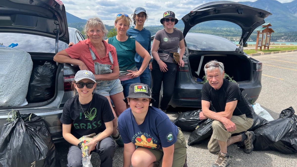 A group of volunteers smiling at the camera