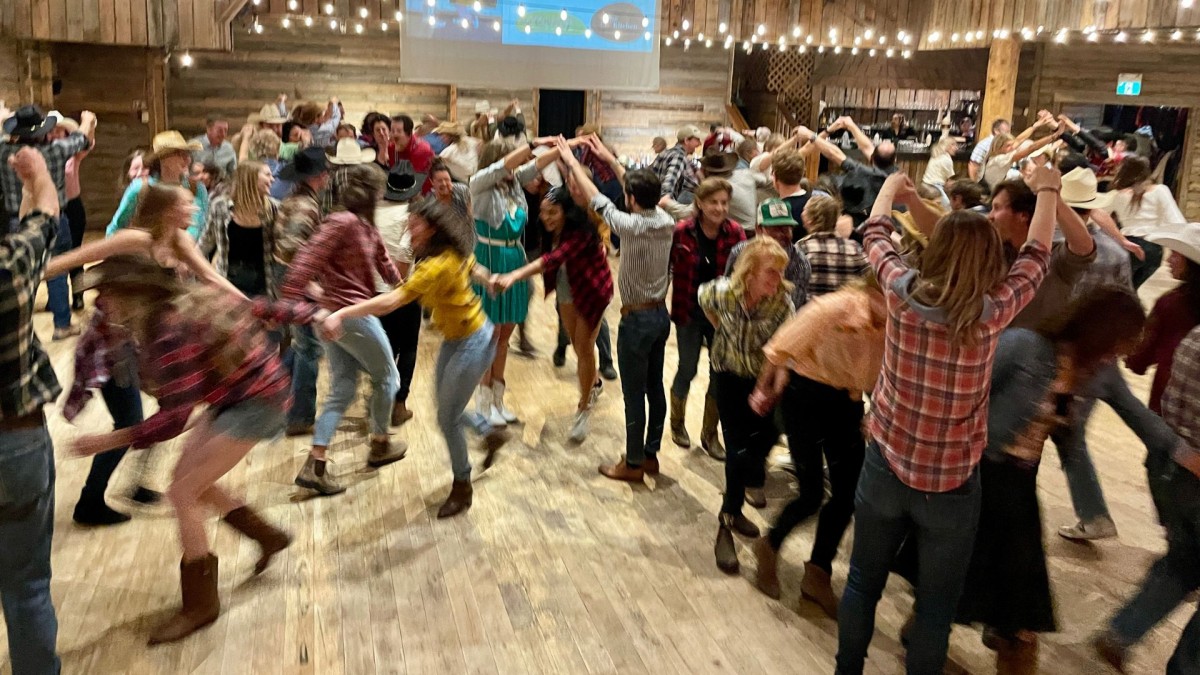 A crowd of people in plaid dancing