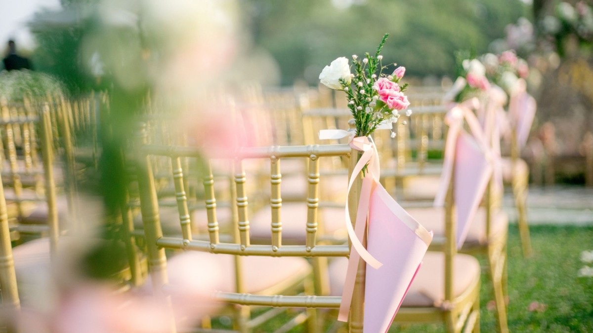 rows of decorative chairs with flower posies on them
