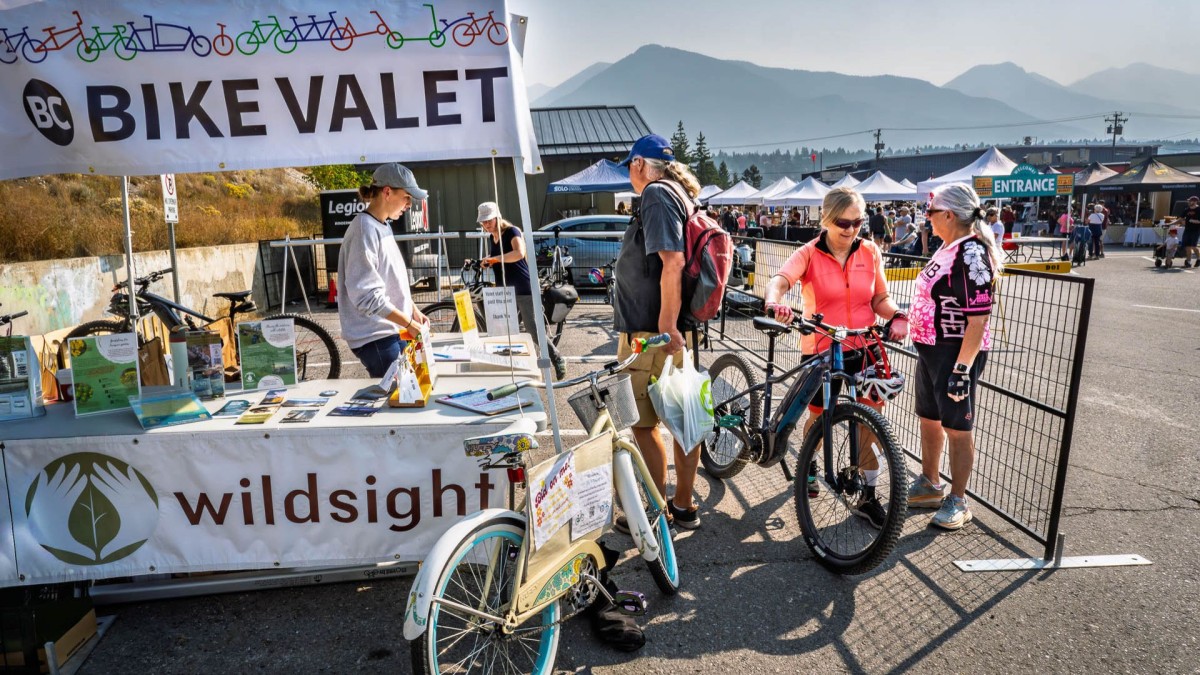 Bike valet users and staff busy storing and retrieving bikes